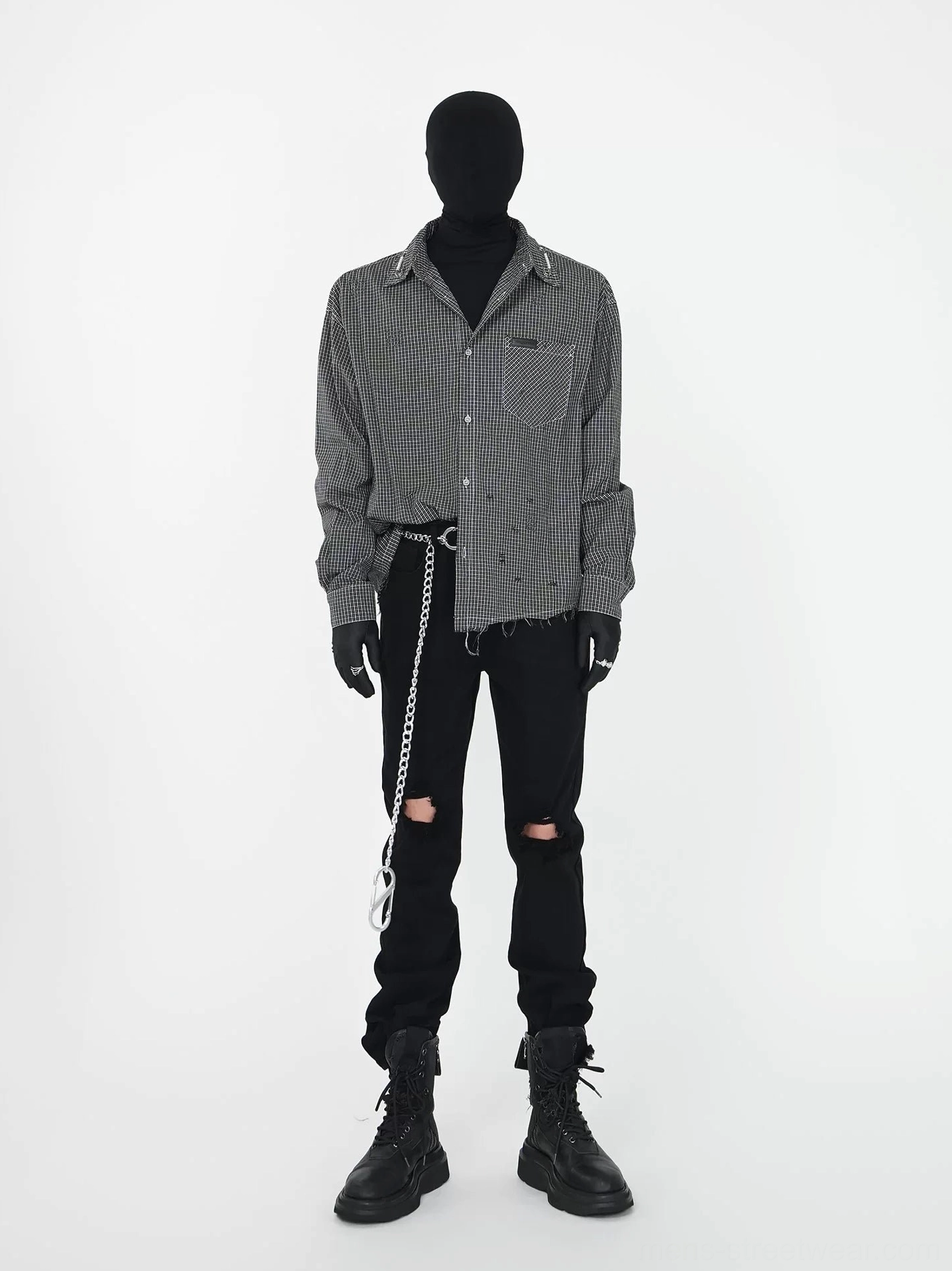 Full outfit styling of black chain detail ripped straight leg jeans with checked shirt black gloves and platform combat boots