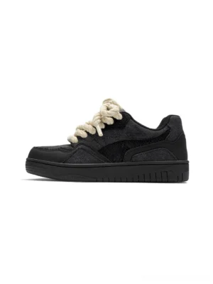Black chunky lace low-top platform street sneakers in left side profile with cream rope shoelaces