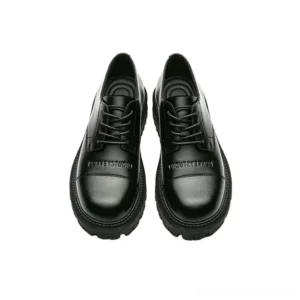 Black chunky leather derby shoes with polished split cowhide upper, round toe, lace-up closure, thick lug rubber outsole, and minimalist Korean streetwear design on a white studio background