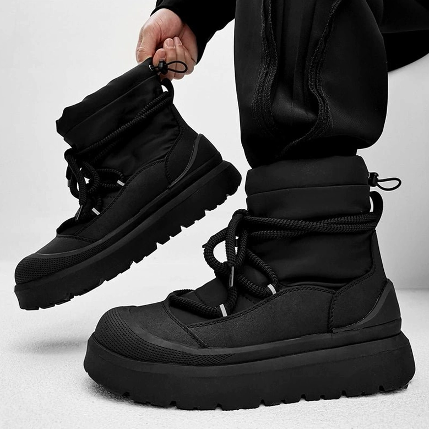 All black chunky platform winter boots with padded ankle collar mixed textile upper and heavy streetwear outsole