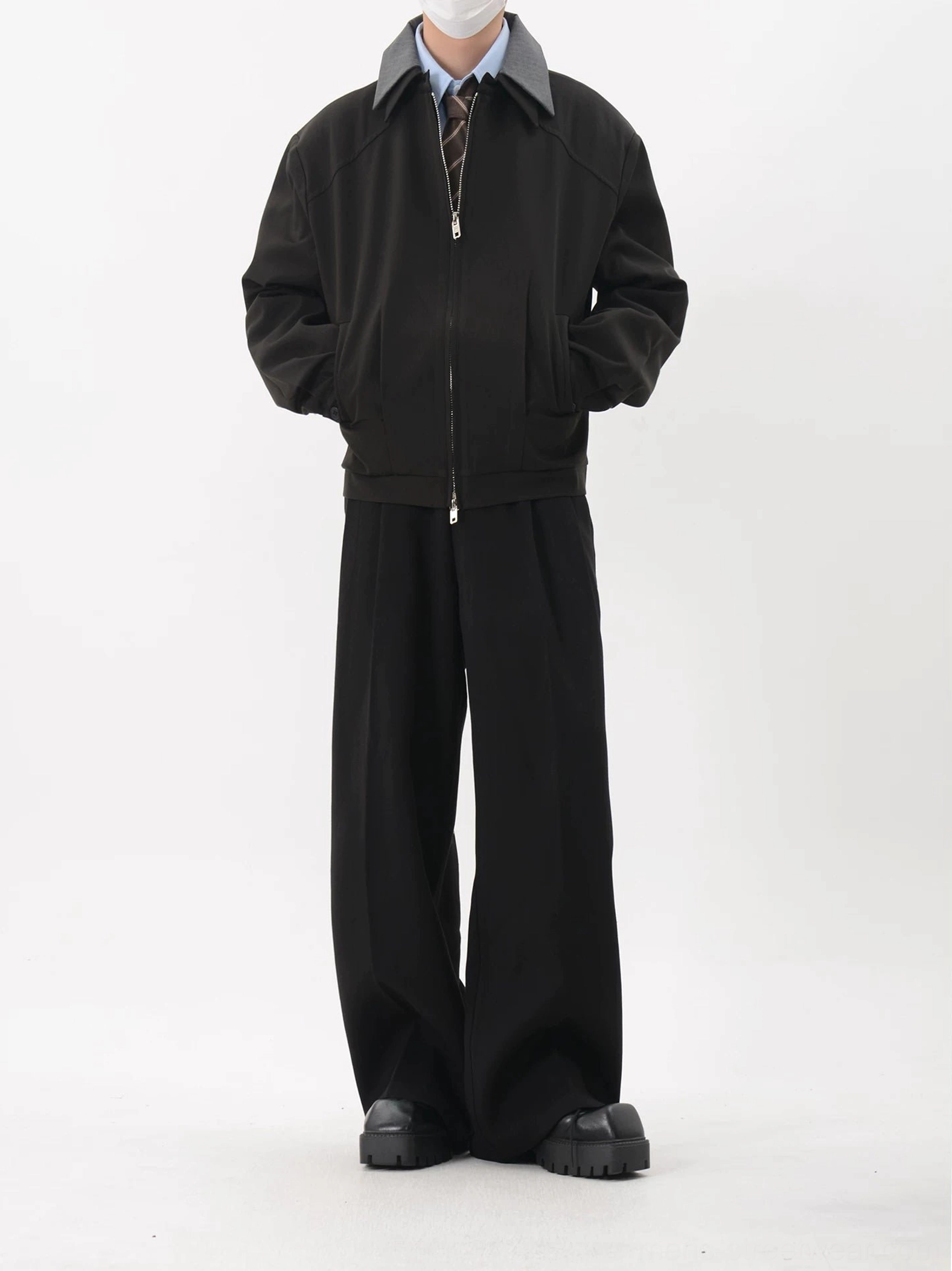 Black contrast collar cropped blouson jacket full front view styled with shirt tie wide leg trousers and leather shoes