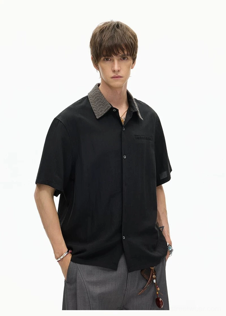 Black textured collar streetwear shirt with button placket and chest pocket styled with grey loose trousers