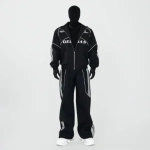 Black contrast piping racing track jacket and wide-leg pants set shown in full front view with white sneakers