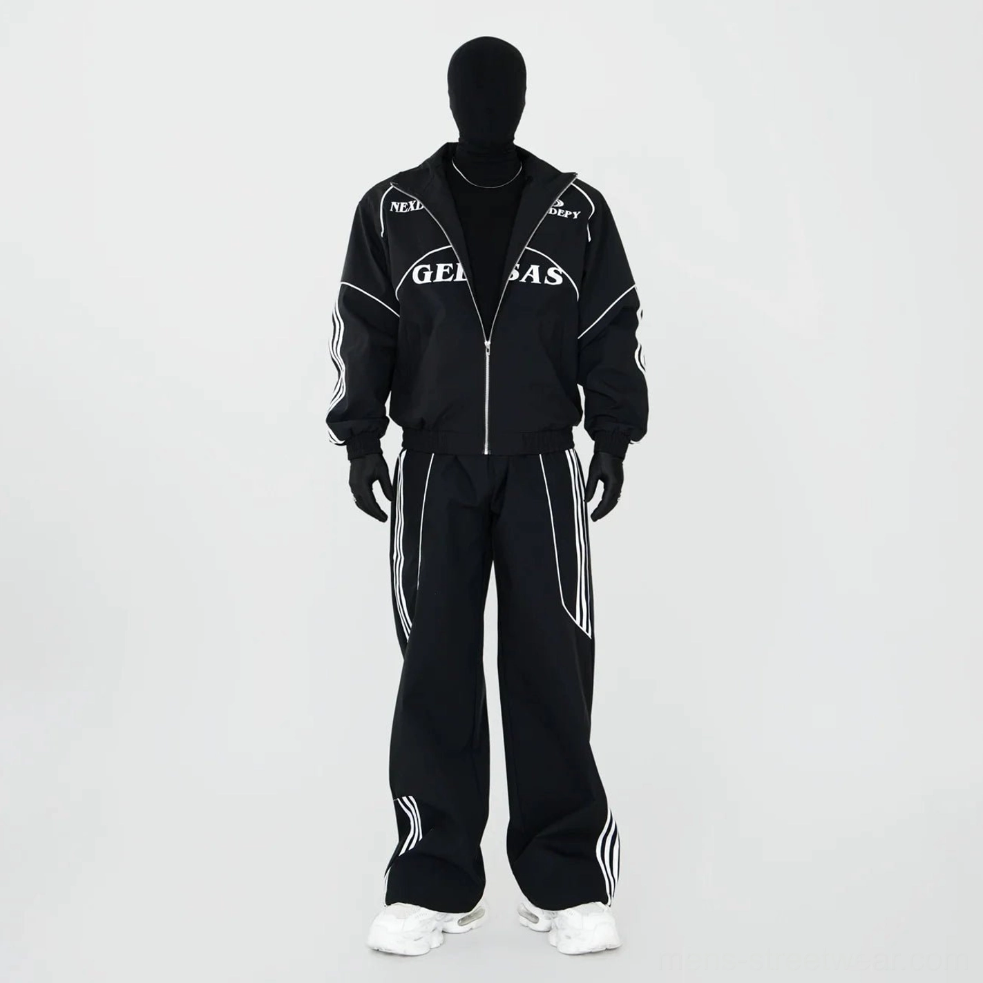 Black contrast piping racing track jacket and wide-leg pants set shown in full front view with white sneakers