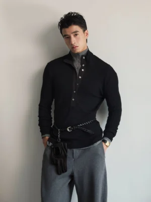 Black contrast placket long-sleeve polo shirt in slim knit fabric styled with gray wide-leg trousers in a minimalist Korean streetwear outfit