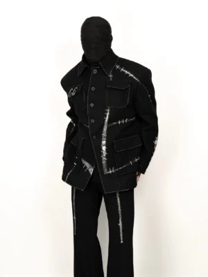 Black contrast stitch utility jacket worn in a front three-quarter view with oversized flap pockets, structured shoulders, and white deconstructed stitching