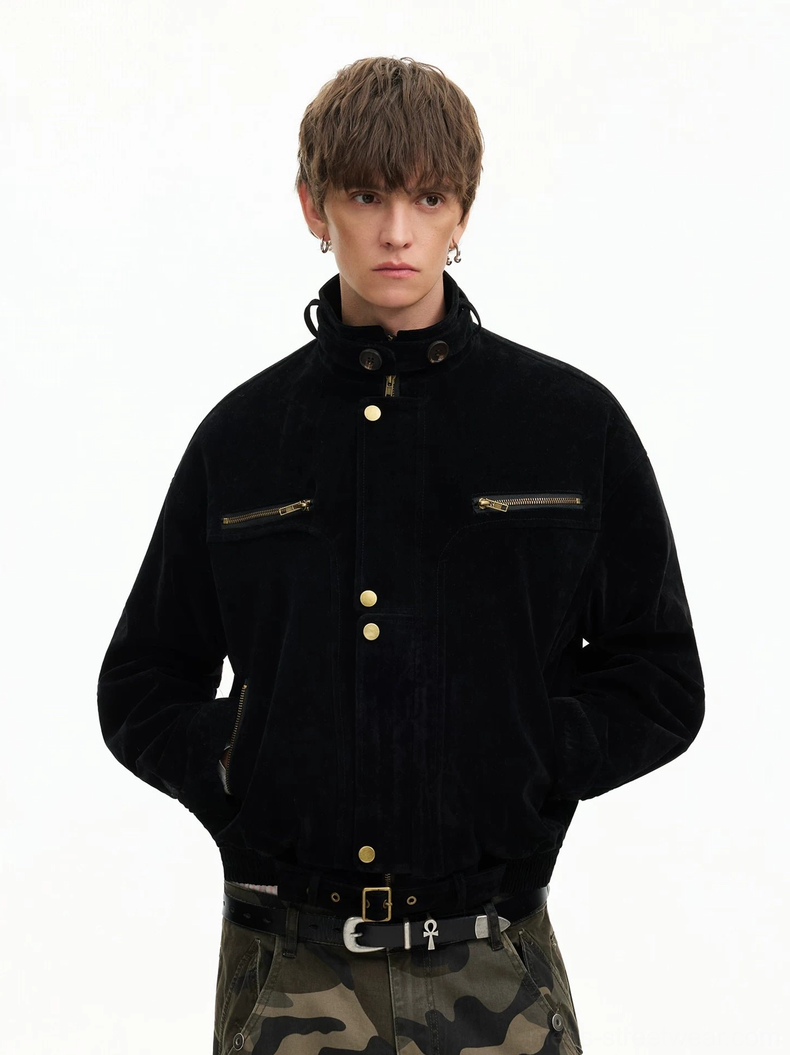 Black corduroy utility bomber jacket with gold snap buttons and stand collar front view styled with camo cargo pants