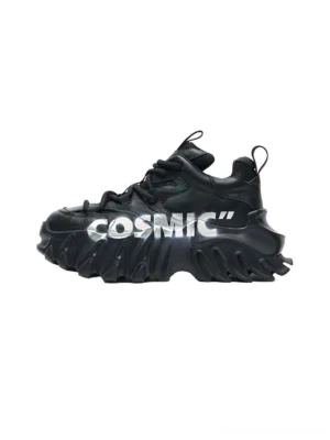 Black Cosmic graphic platform derby sneakers shown from a side three-quarter angle with genuine leather upper, cosmic lettering, heel pull tab, and rugged sculpted chunky sole