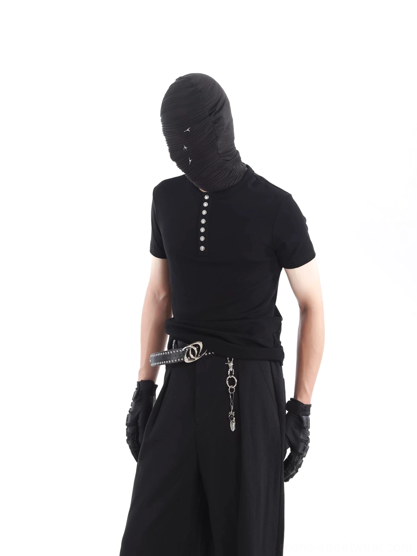 Three quarter view of black cotton Henley T-shirt showing the ribbed texture and vertical metallic neckline buttons