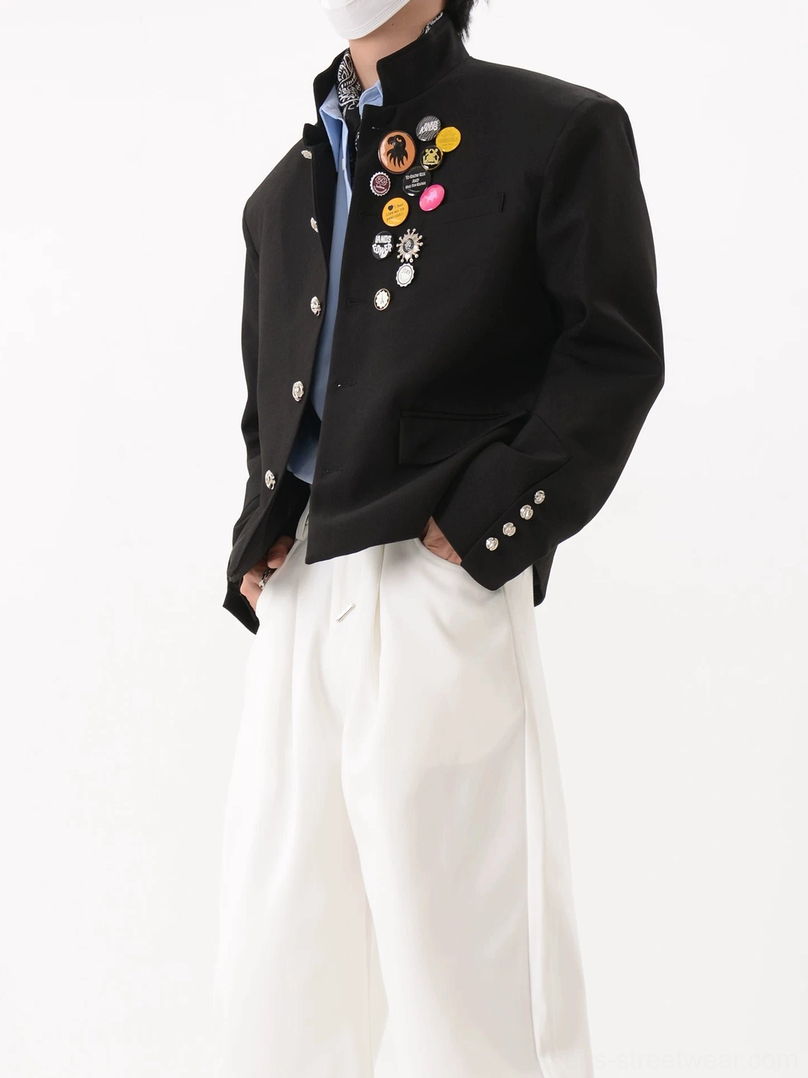 Black crest badge cropped blazer styled with a patterned neck scarf in a modern Seoul streetwear tailoring outfit