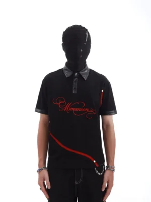 Front view of black crimson arc faux leather collar polo shirt with red graphic stripe and silver stud streetwear details