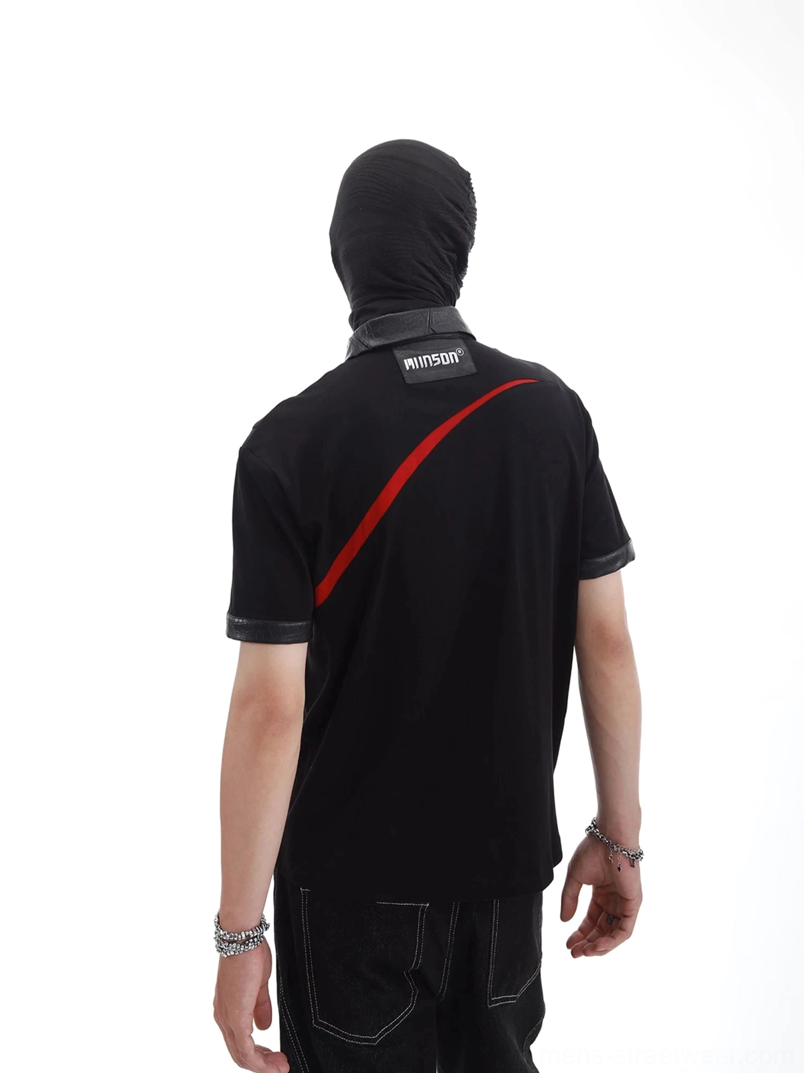 Back view of black crimson arc polo shirt showing faux leather collar sleeve cuffs and angled red streetwear graphic