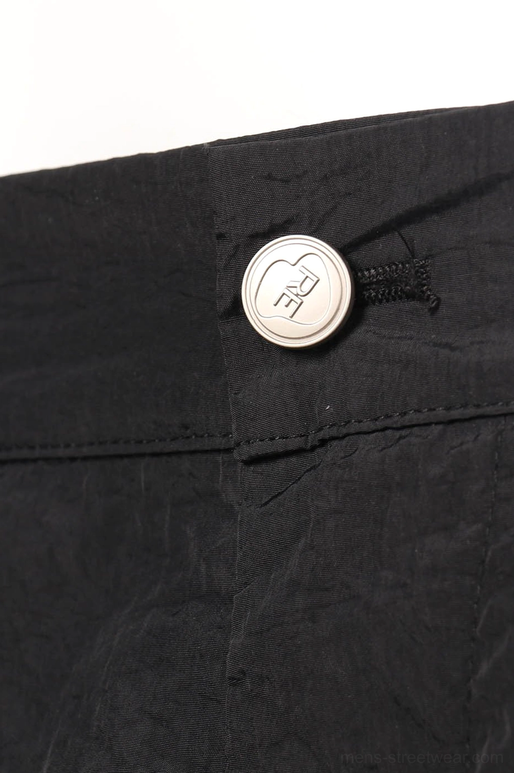 Black crinkled nylon wide-leg track pants streetwear product view with relaxed technical silhouette