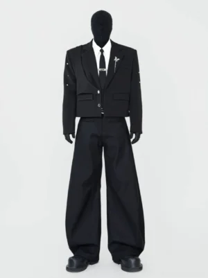 Black cropped blazer outfit styled with wide-leg trousers and necktie, showing formal Korean streetwear tailoring and layered avant-garde proportions