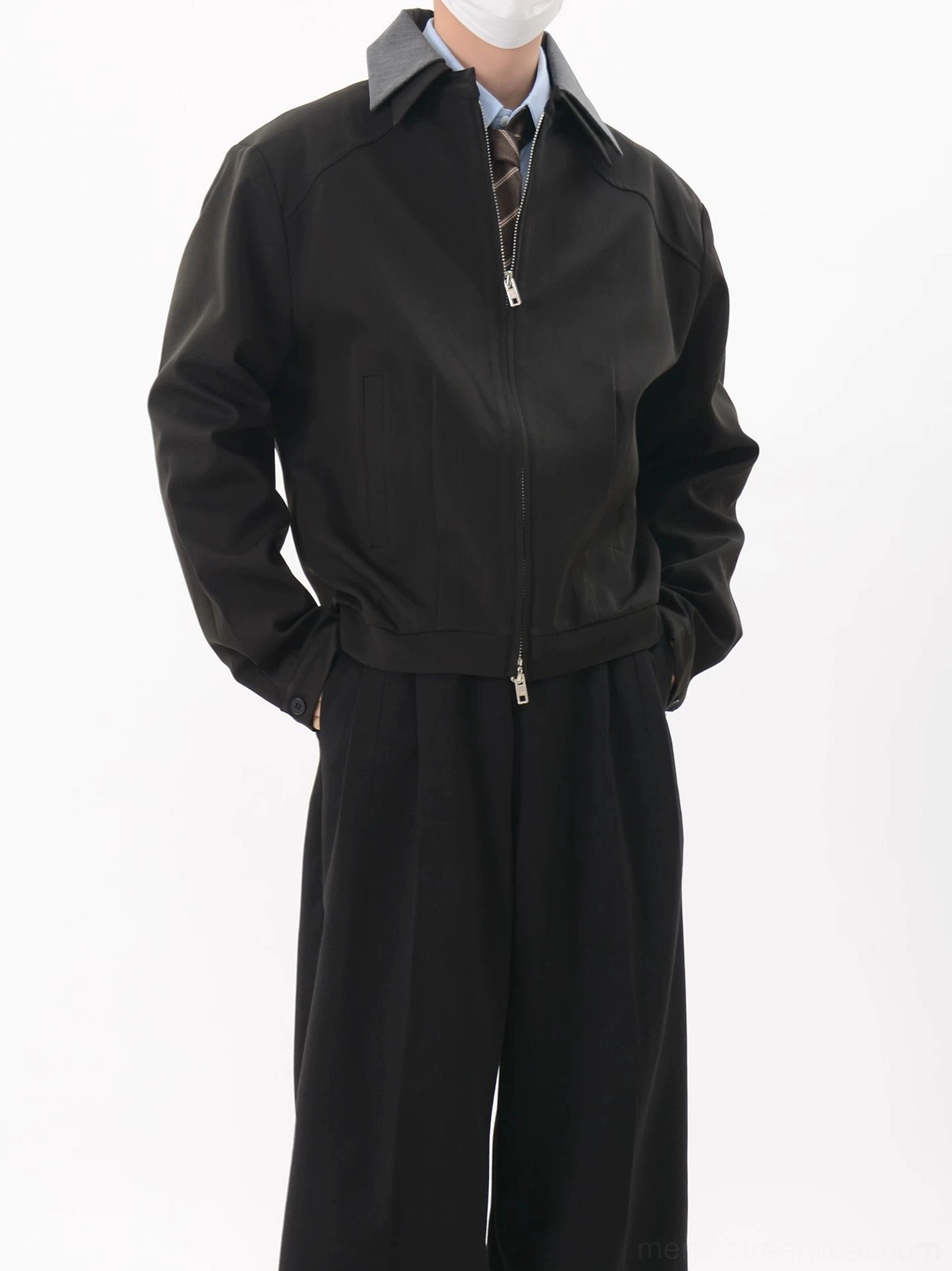 Black cropped contrast collar zip blouson jacket close view showing dual zipper pulls raglan sleeves and relaxed tailored fit