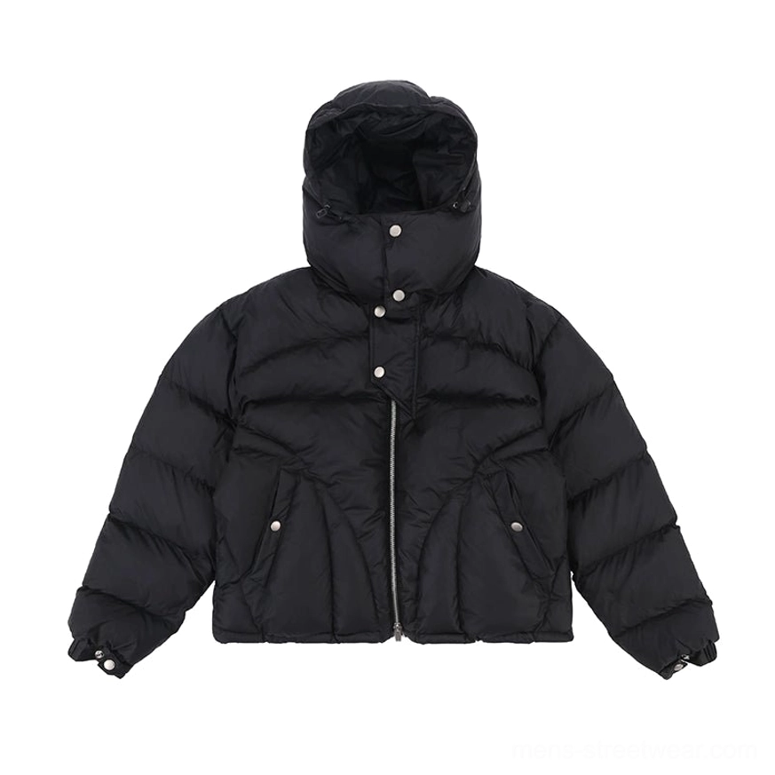 Close up of black cropped hooded puffer jacket front zipper snap button storm placket and padded construction