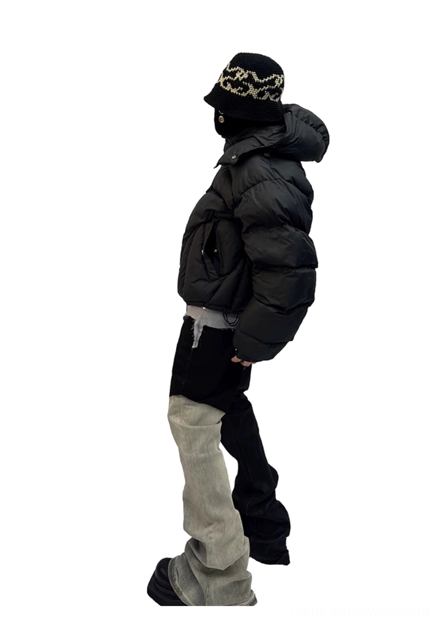 Black cropped puffer jacket styled in urban streetwear outfit with oversized padded fit and hood