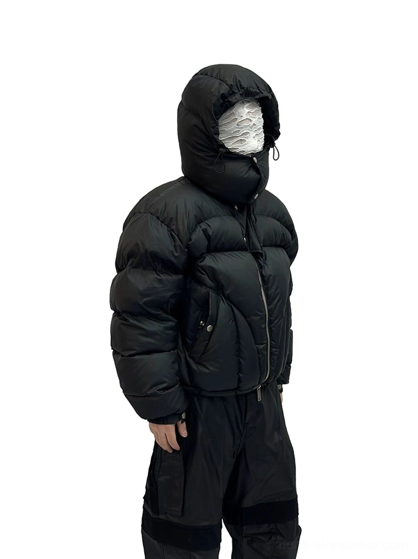 Black cropped puffer jacket three quarter side view showing zip pockets metal studs and adjustable hood