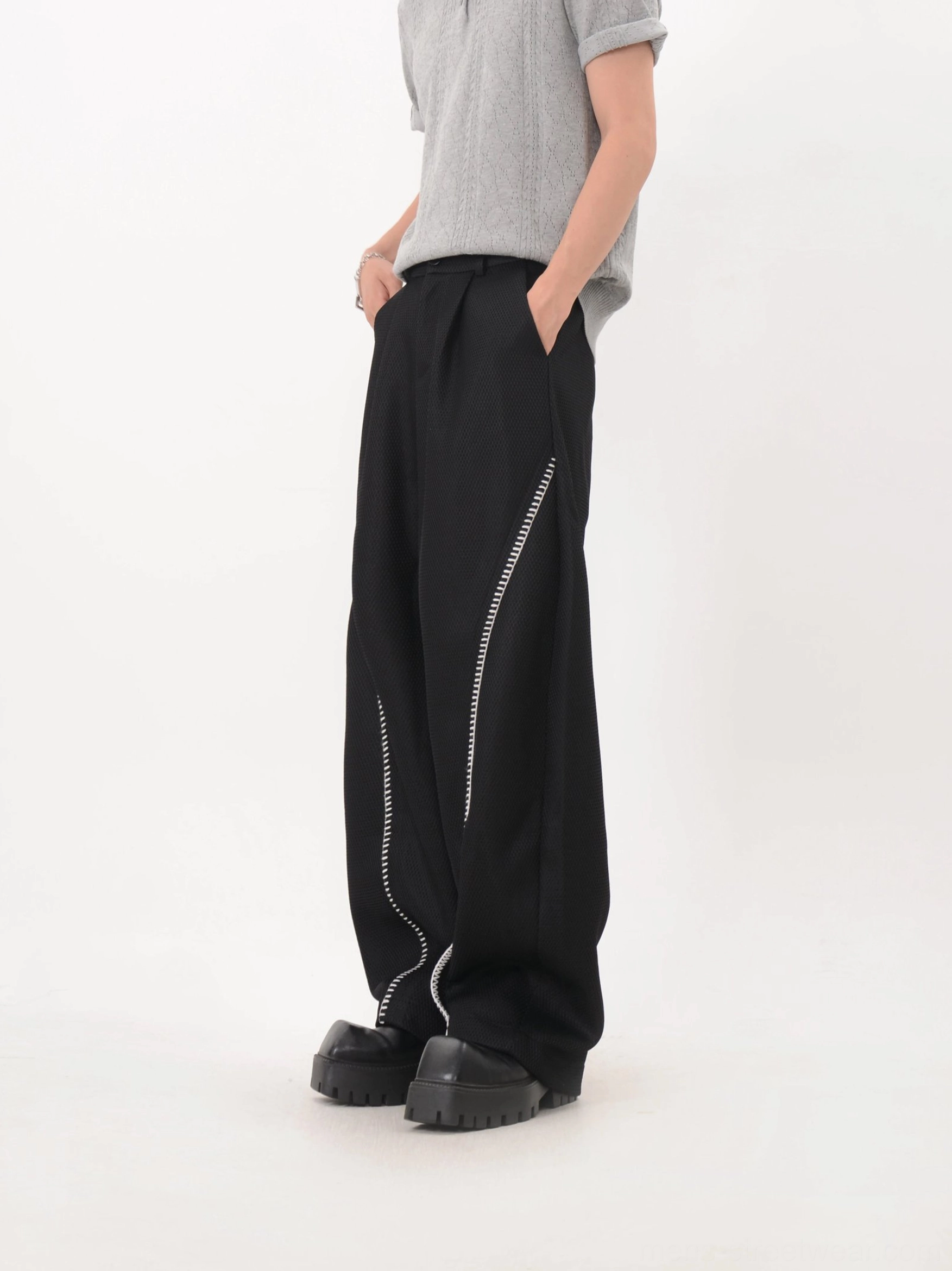 Black curve trim wide leg Korean fashion trousers with relaxed baggy fit three quarter rear side view