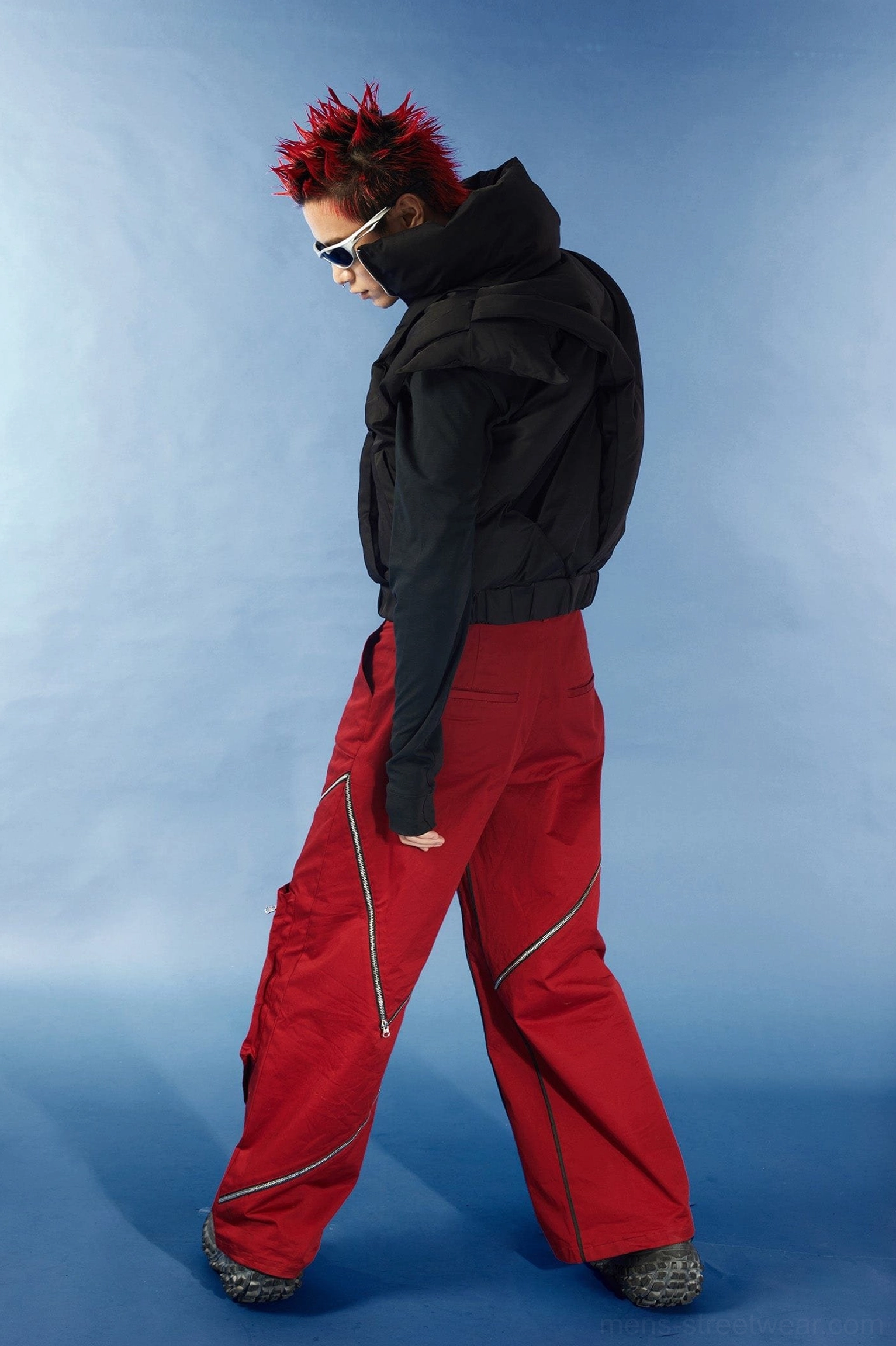 Avant-garde black cropped puffer vest with open back cutout detail high collar and modern Seoul fashion proportions