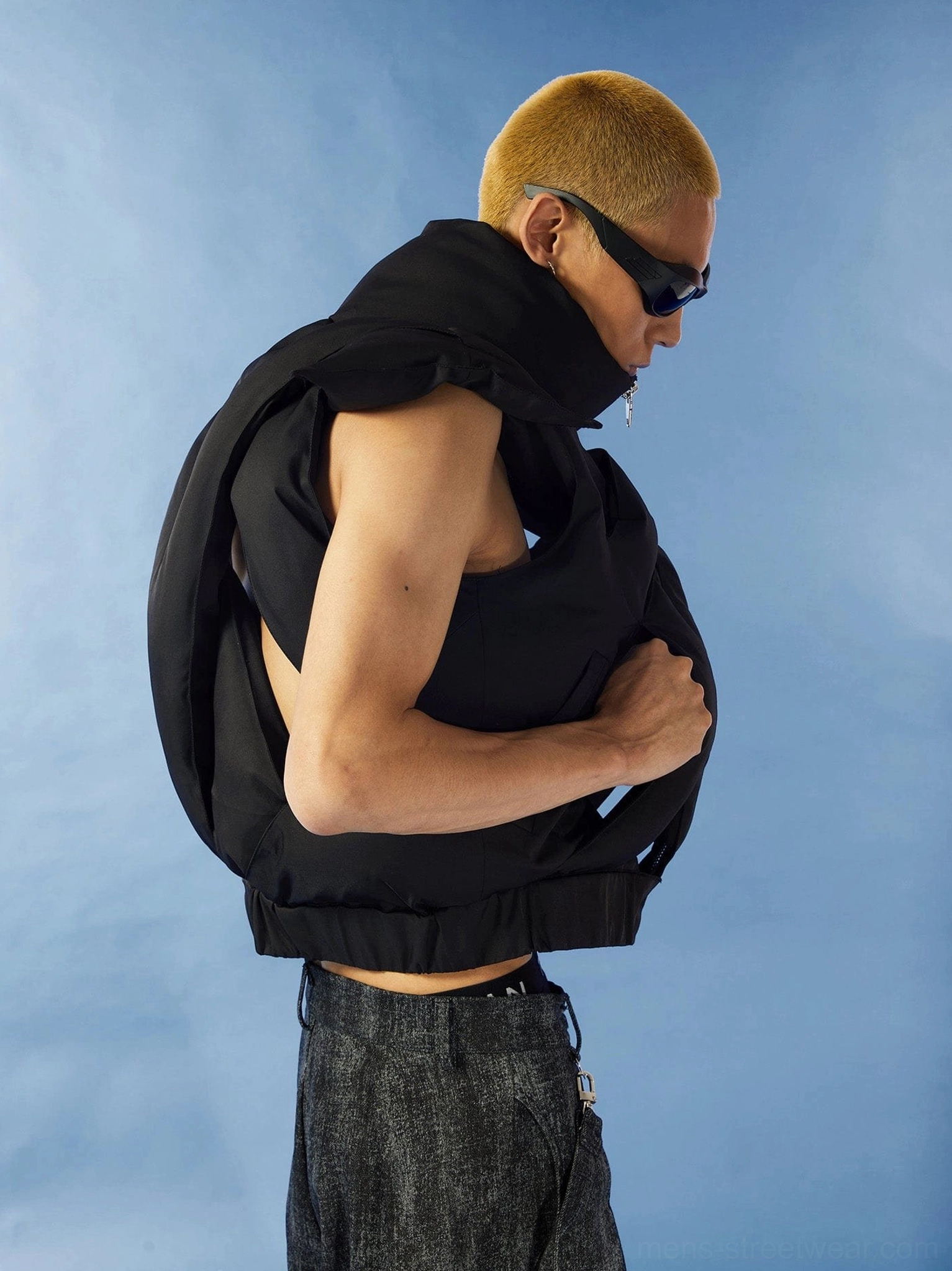 Black cropped cutout puffer vest product image showing padded quilted texture high collar and avant-garde streetwear silhouette