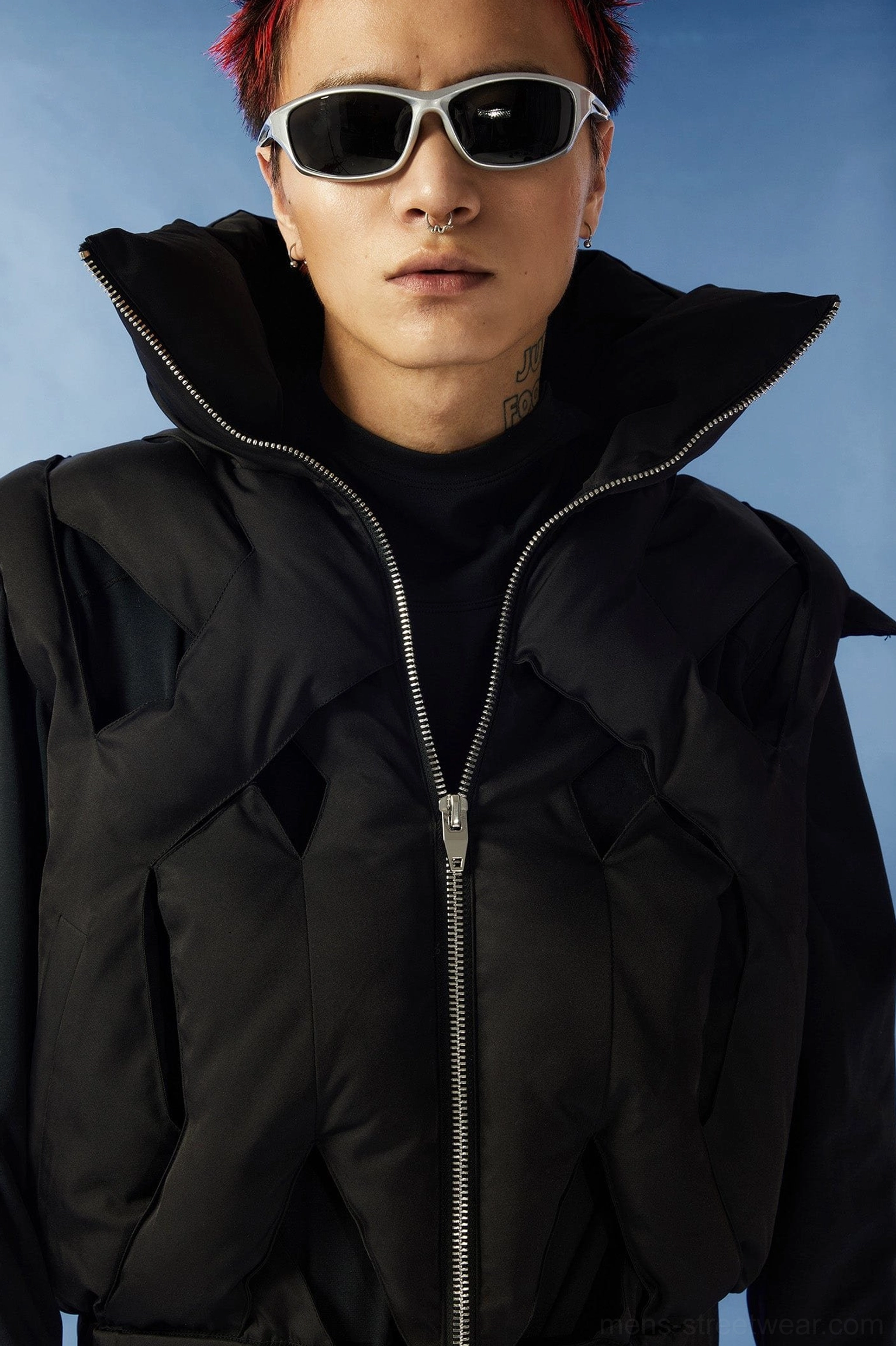 Black puffer cutout vest detail image featuring cropped hem structured shoulders and futuristic Korean fashion design