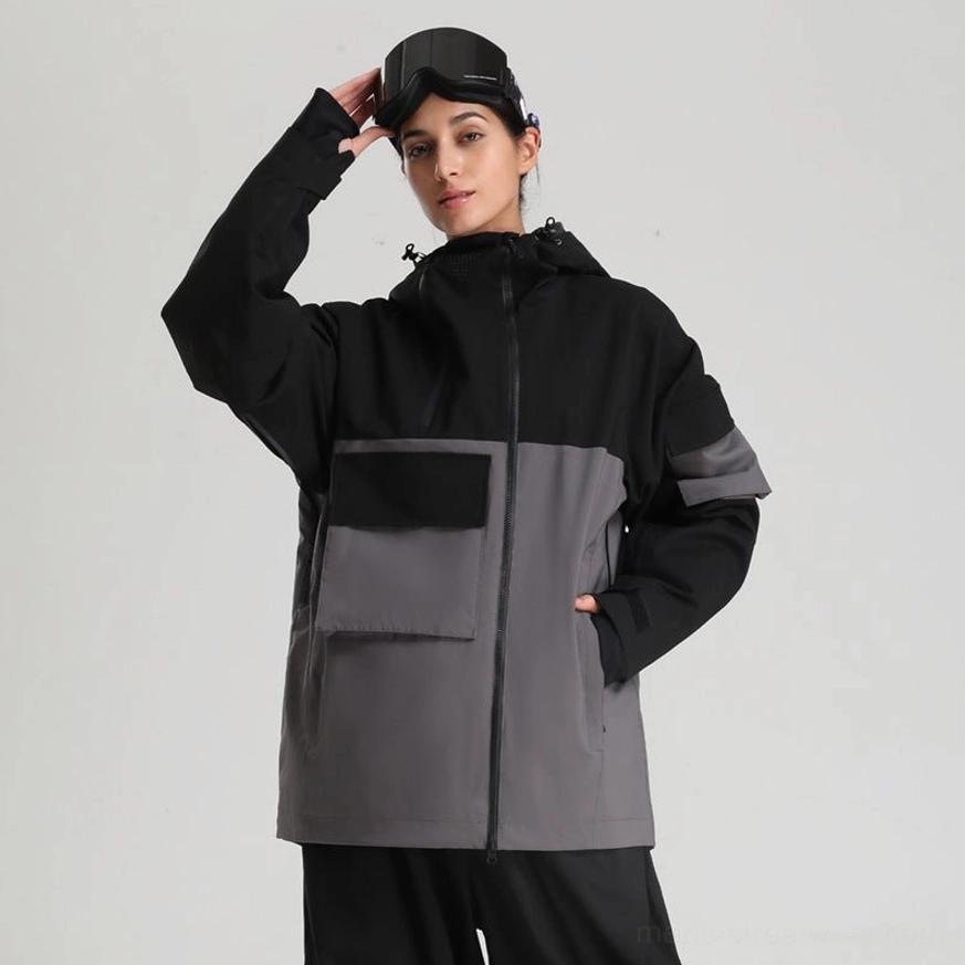 Black and dark grey colorblock ski jacket with attached hood, front flap pockets, central zipper, and modern technical streetwear design