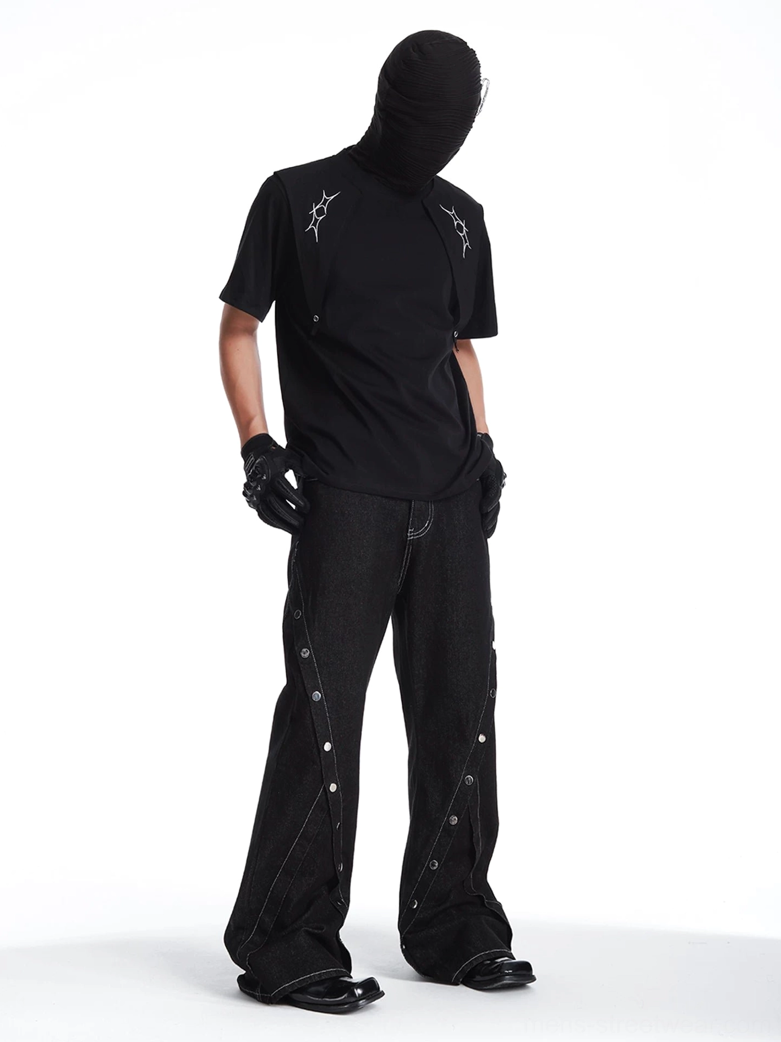 Side view of black deconstructed layered t-shirt styled with wide leg denim for dark Seoul streetwear outfit