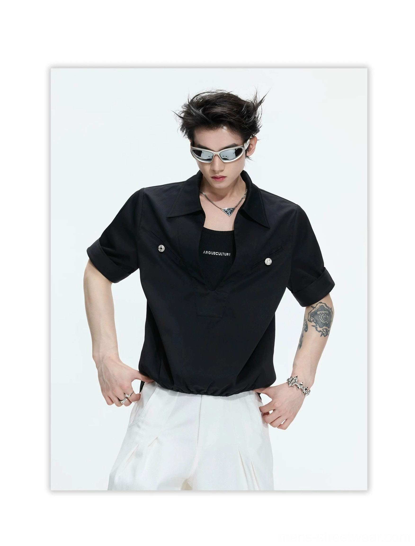 Black deep V-neck half-sleeve utility shirt with rolled cuffs, metallic buttoned chest pockets, pointed collar, and modern Seoul streetwear styling