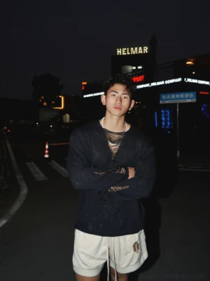 Black distressed lace-up long sleeve knit shirt with mesh-style neckline and relaxed Korean streetwear fit