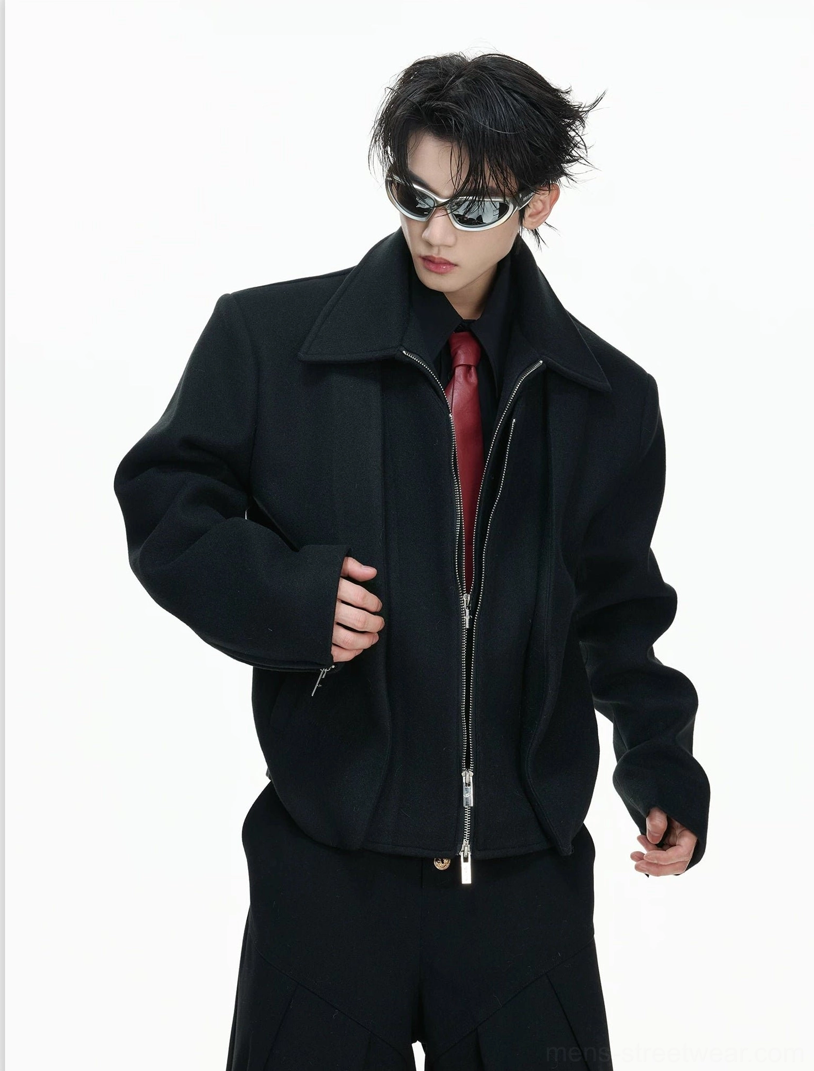 Jet black double-zip sculpted cropped wool jacket with broad shoulders styled over a shirt and red tie