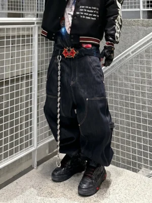Black dragon relief chunky platform sneakers styled with varsity jacket baggy jeans and chain belt Y2K streetwear outfit