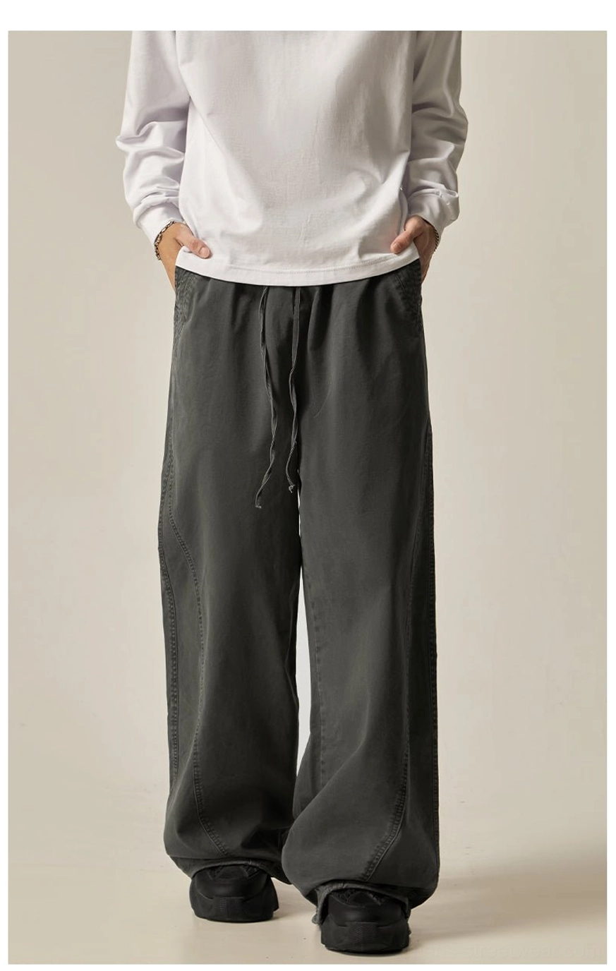 Black drawstring wide-leg pants full view oversized silhouette minimalist streetwear style solid black colorway versatile