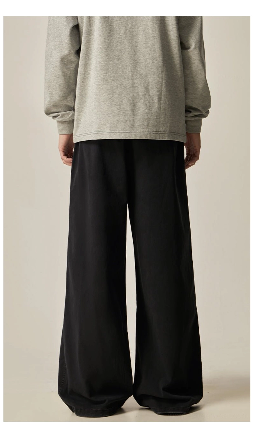 Black drawstring wide-leg pants pocket detail quality stitching functional side pocket minimalist streetwear construction