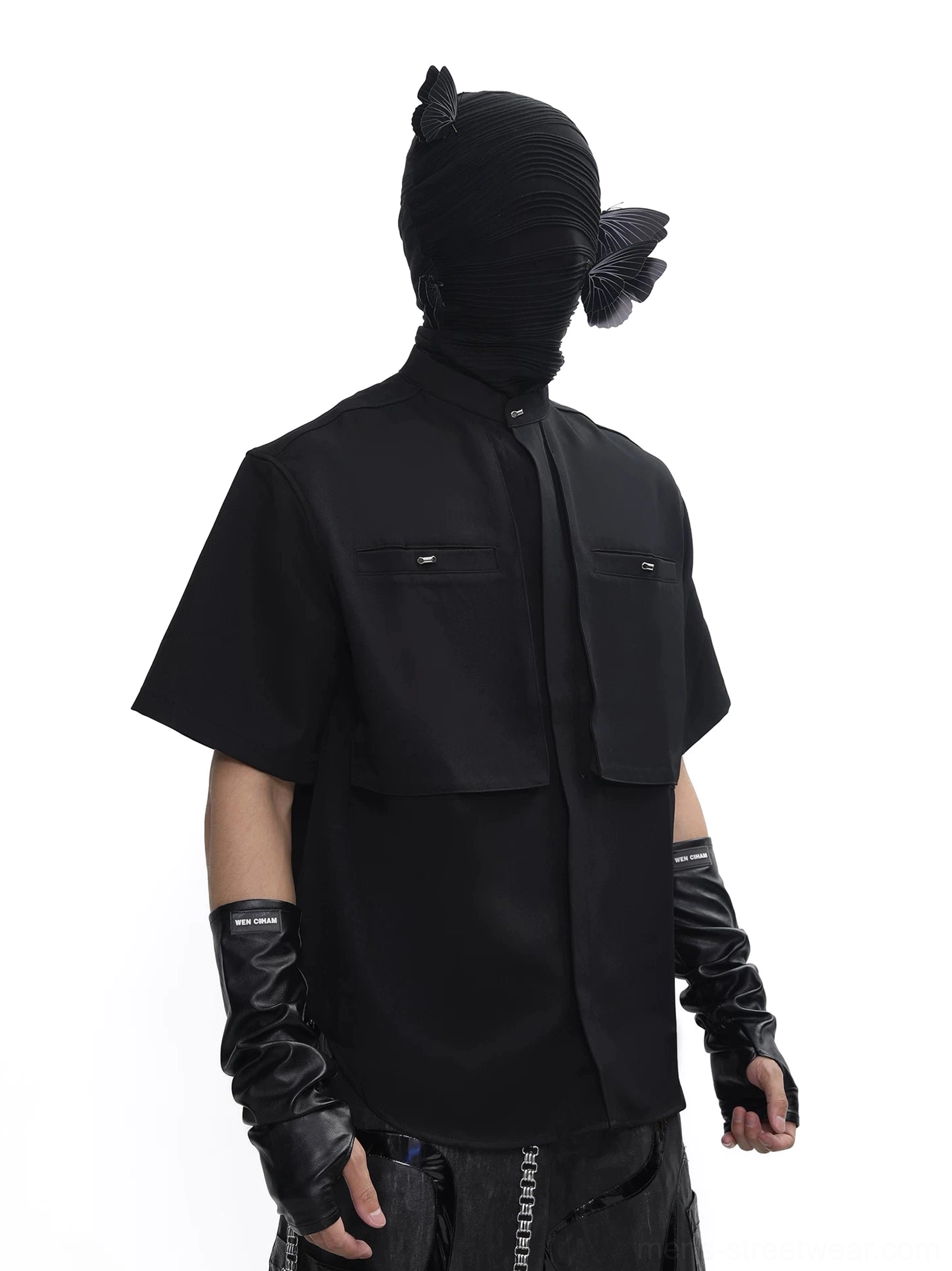 Black dual-pocket stand collar utility tech shirt rear three-quarter view with structured short sleeves and curved hem