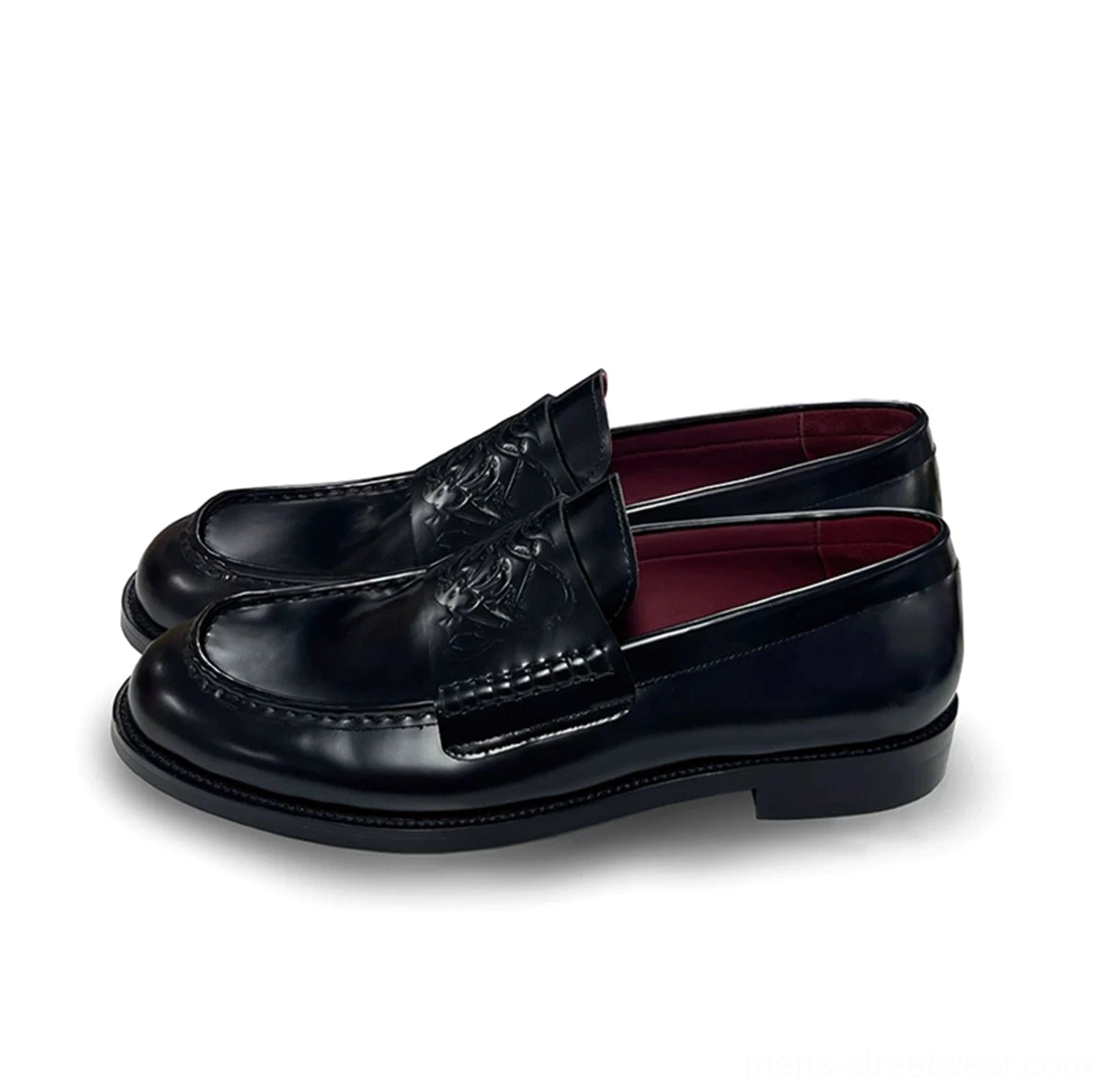 Black leather embossed loafers in a clean three-quarter product view showing the structured square-toe silhouette and burgundy lining