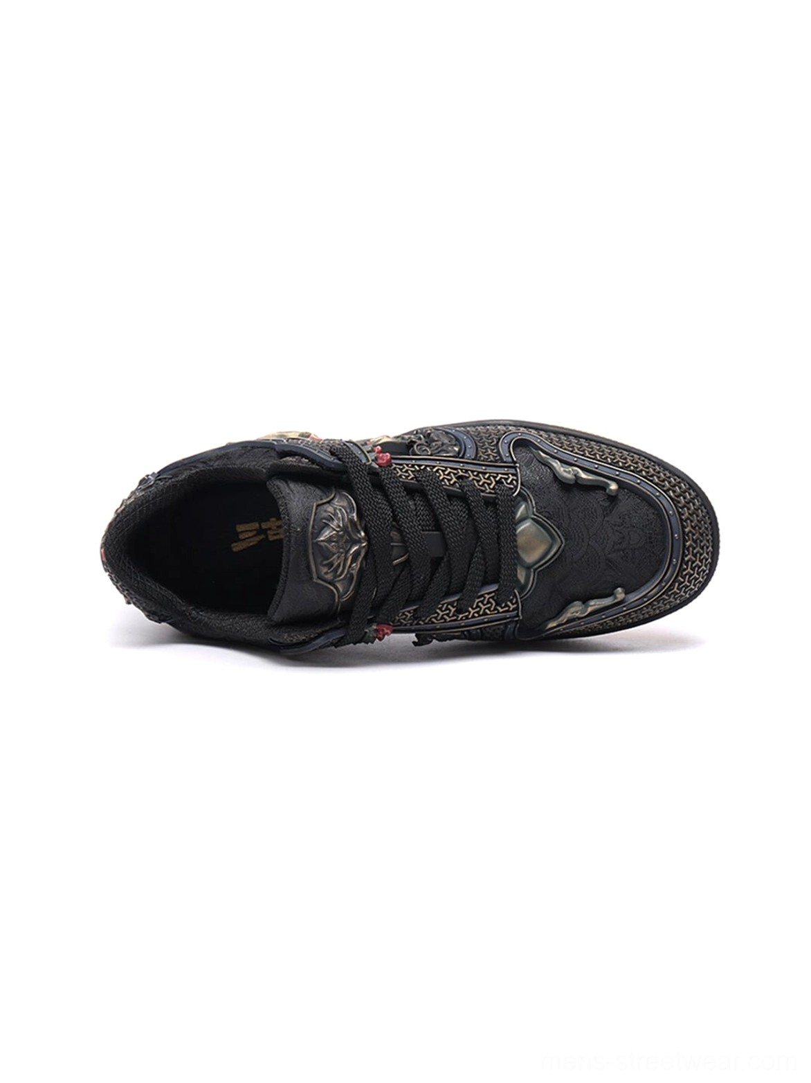 Black embroidered dragon sneakers styled as expressive East Asian streetwear footwear with layered construction