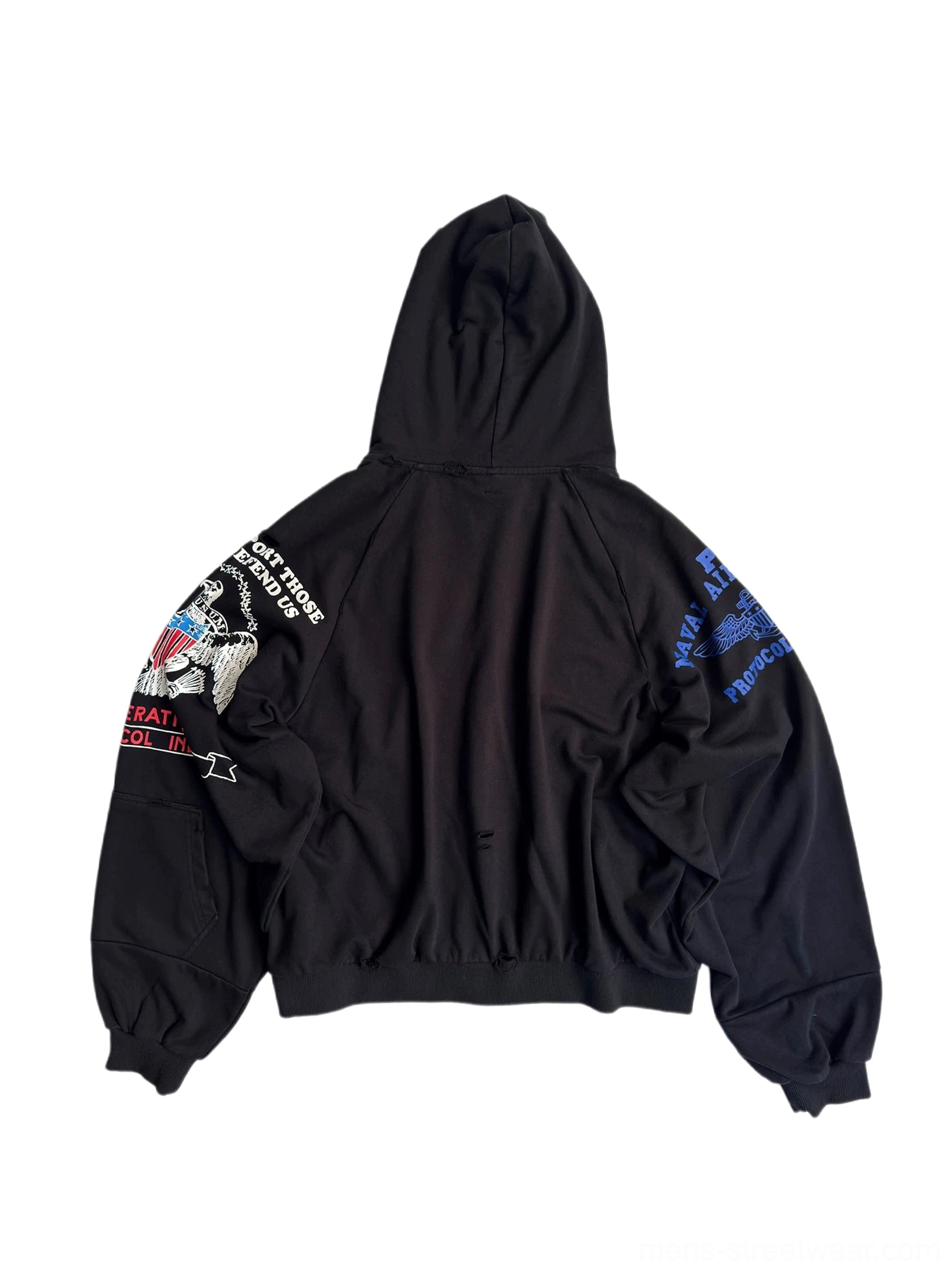 Back flat lay view of black embroidered streetwear hoodie showing complete sleeve patch artwork, ribbed cuffs, ribbed hem, and front pocket edge