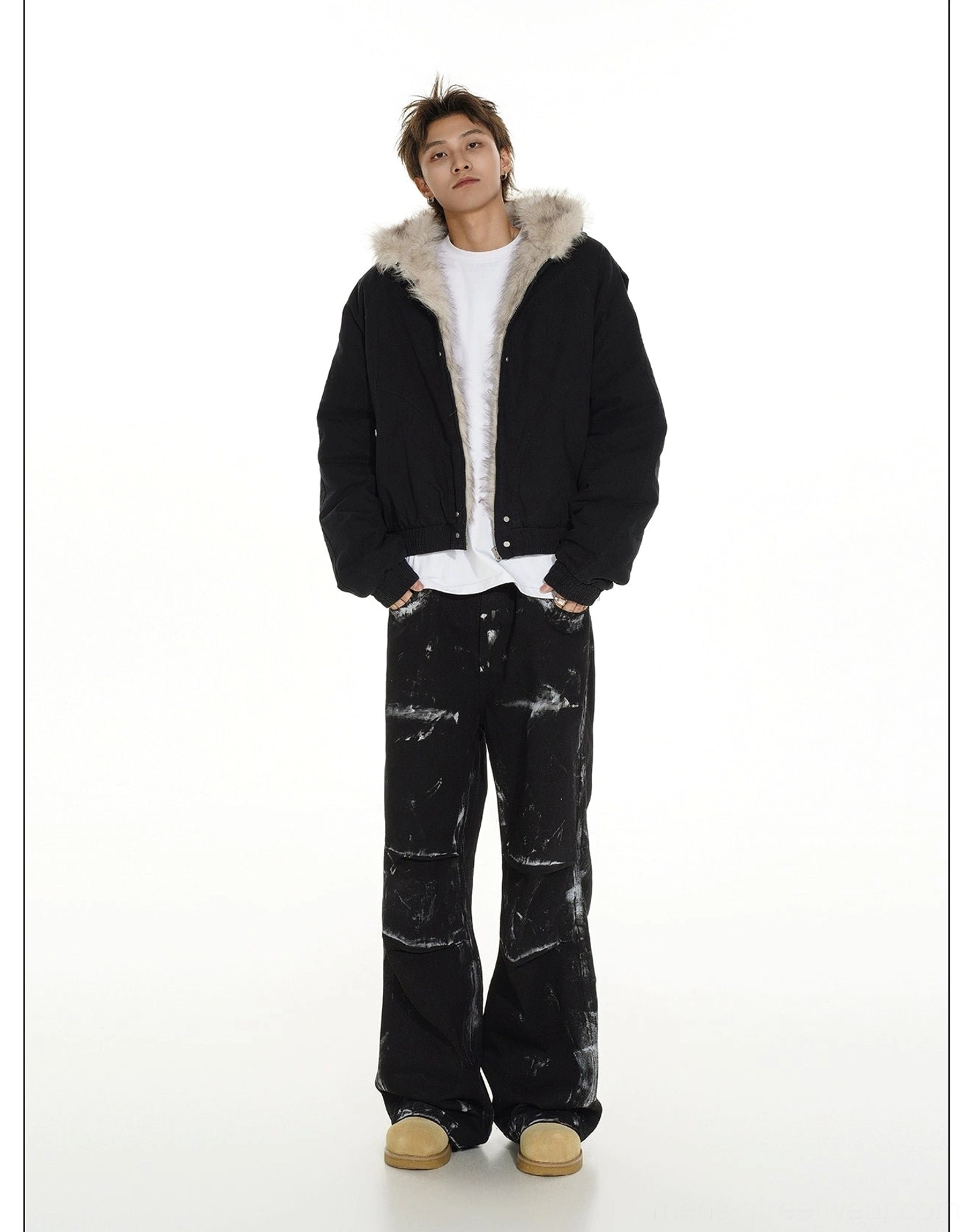 Black faux fur lined hooded cropped bomber jacket shown from a rear three-quarter full-body view with relaxed streetwear proportions