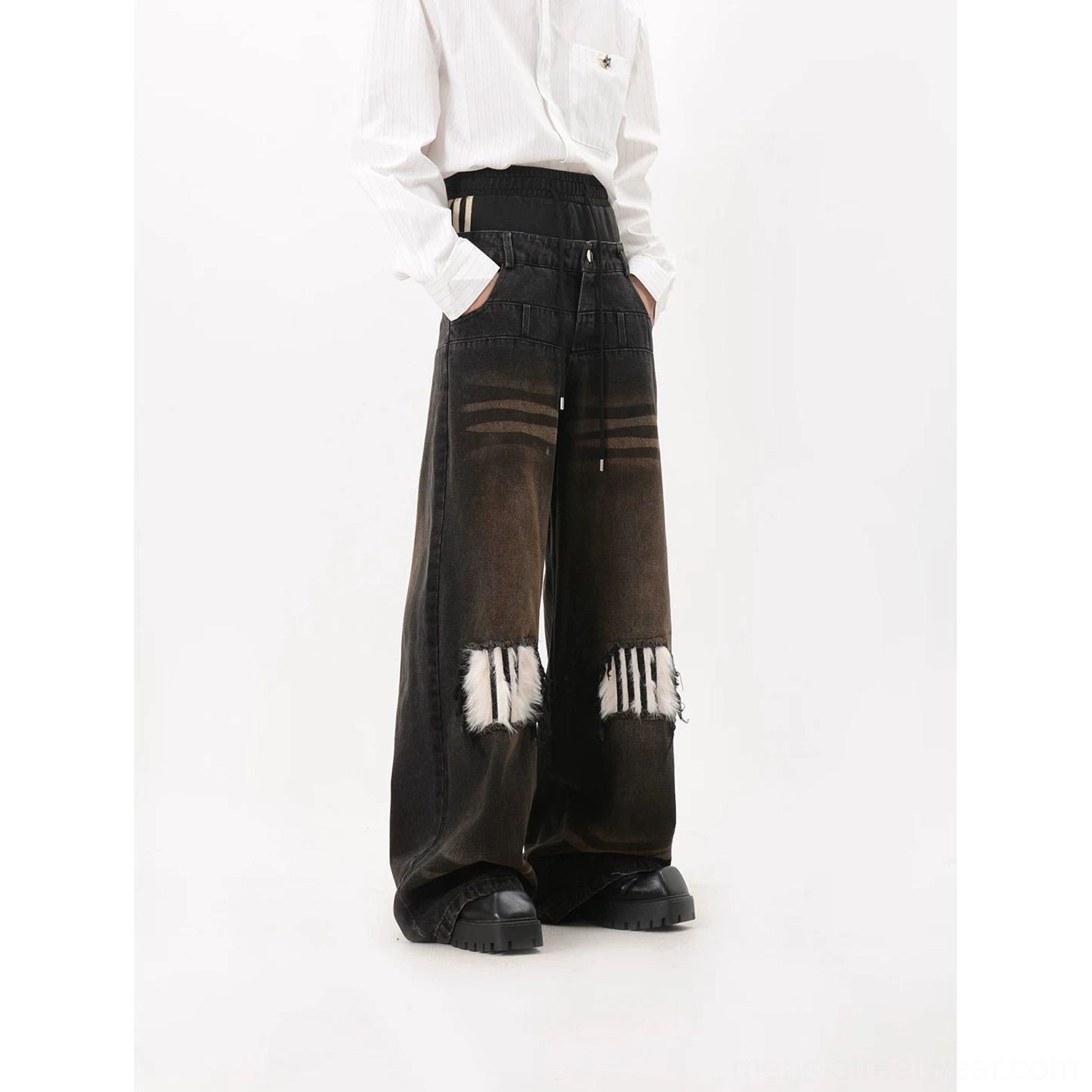 Back right three quarter view of black faux fur patch wide leg jeans showing the long stacked leg, high waist, gradient denim wash and oversized rear silhouette
