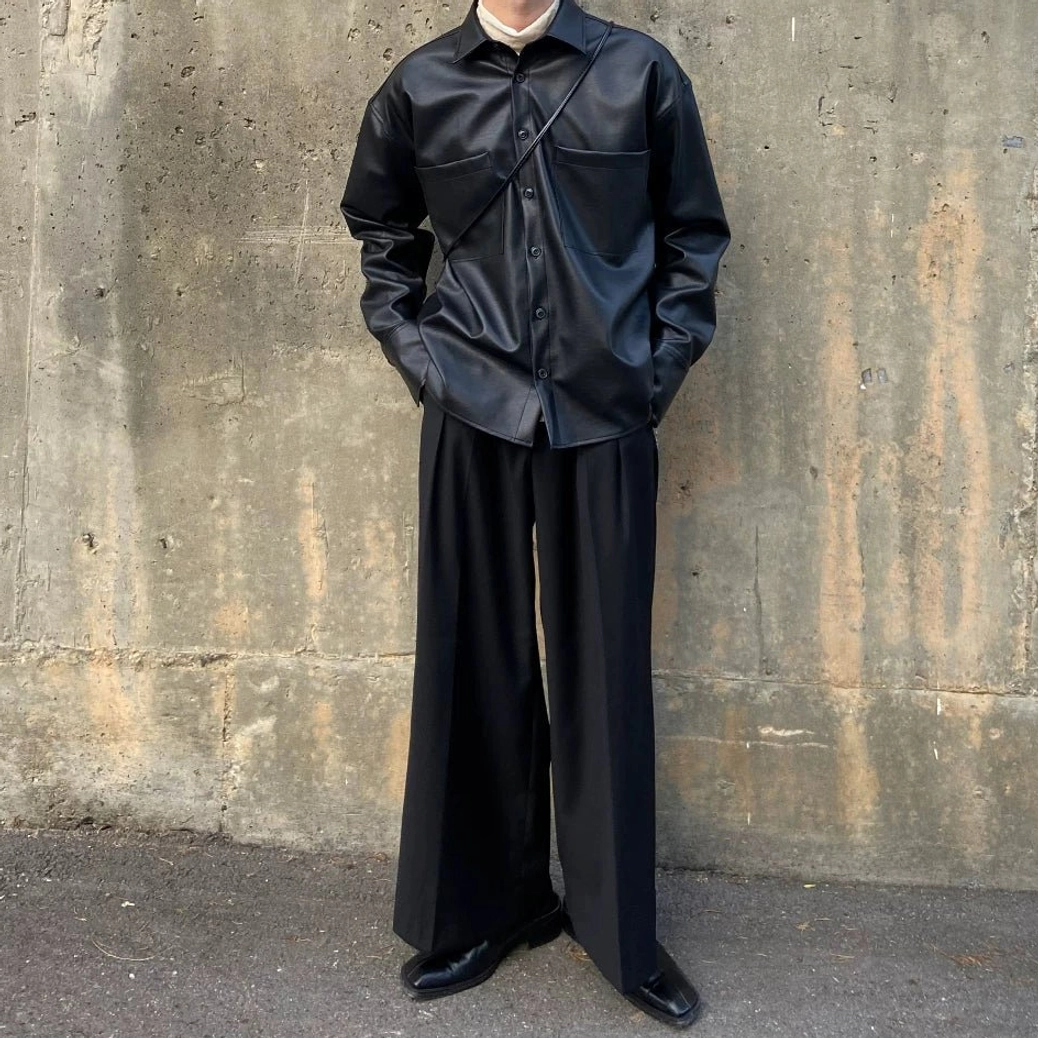 Full body black faux leather shirt jacket outfit with clean straight hem, relaxed silhouette and minimalist formal streetwear styling
