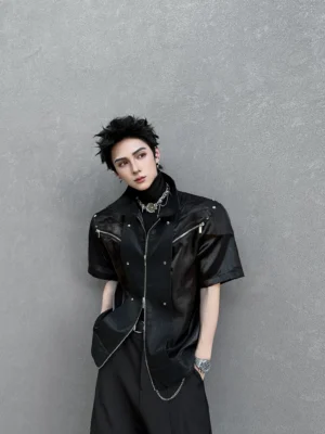 Black faux leather short sleeve moto overshirt front full body view styled with black turtleneck and wide leg trousers