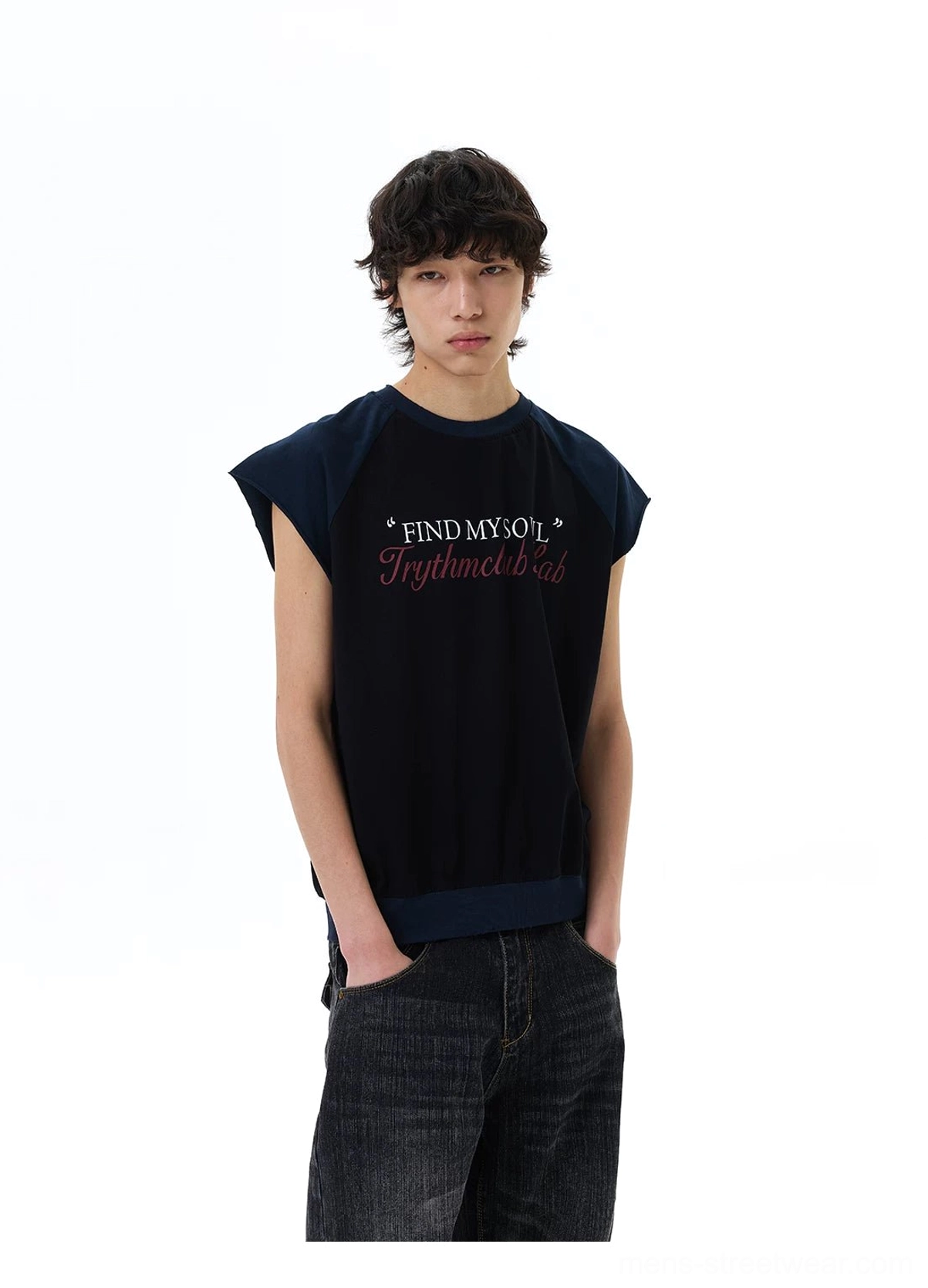 Side view of black Find My Soul raglan cap-sleeve tee styled with dark wash baggy jeans for an urban outfit