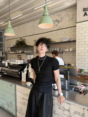 Black slim-fit mock-neck T-shirt styled with wide-leg black pants and jewelry in a Seoul streetwear outfit