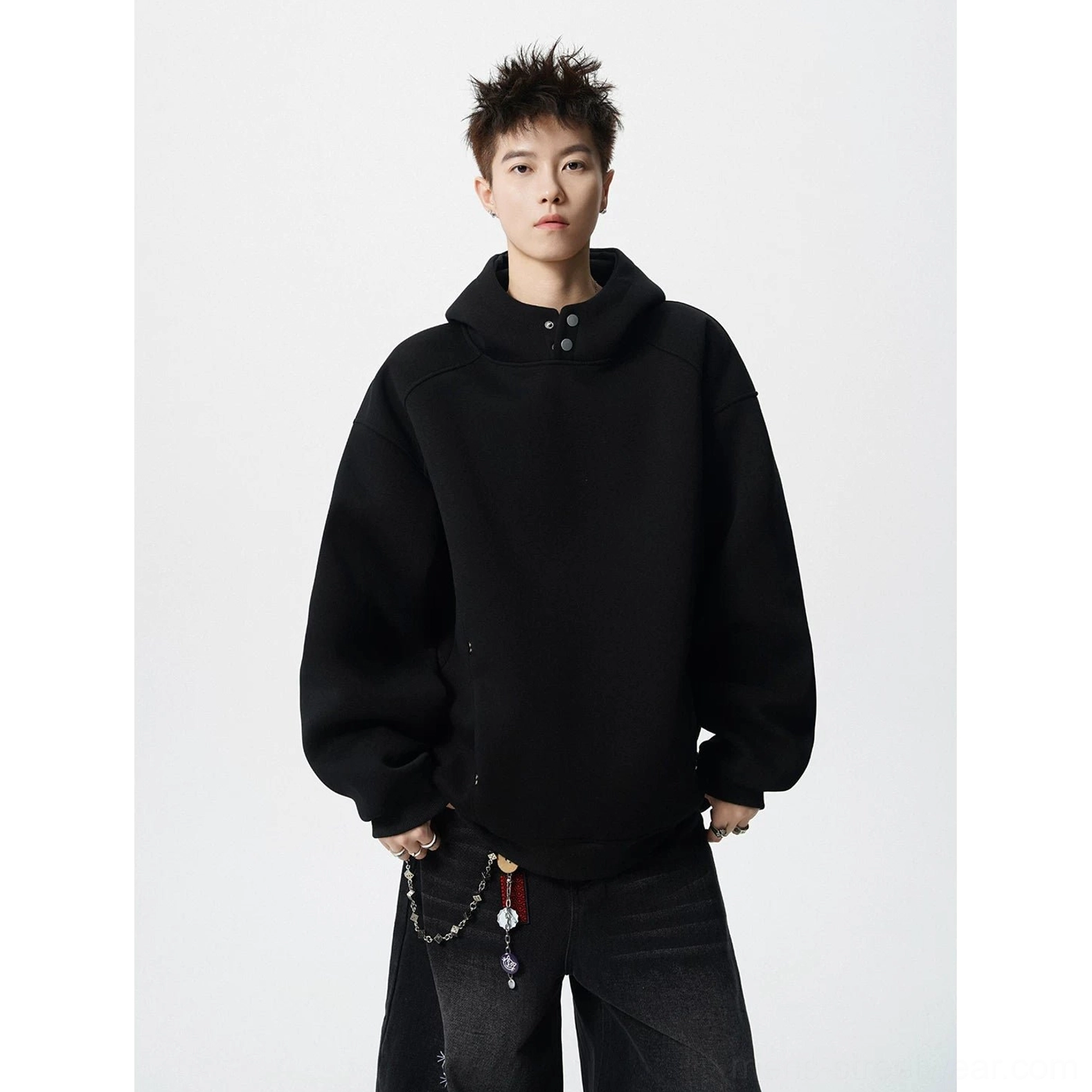 Black fleece lined oversized snap neck hoodie with high collar paired with black wide leg streetwear pants
