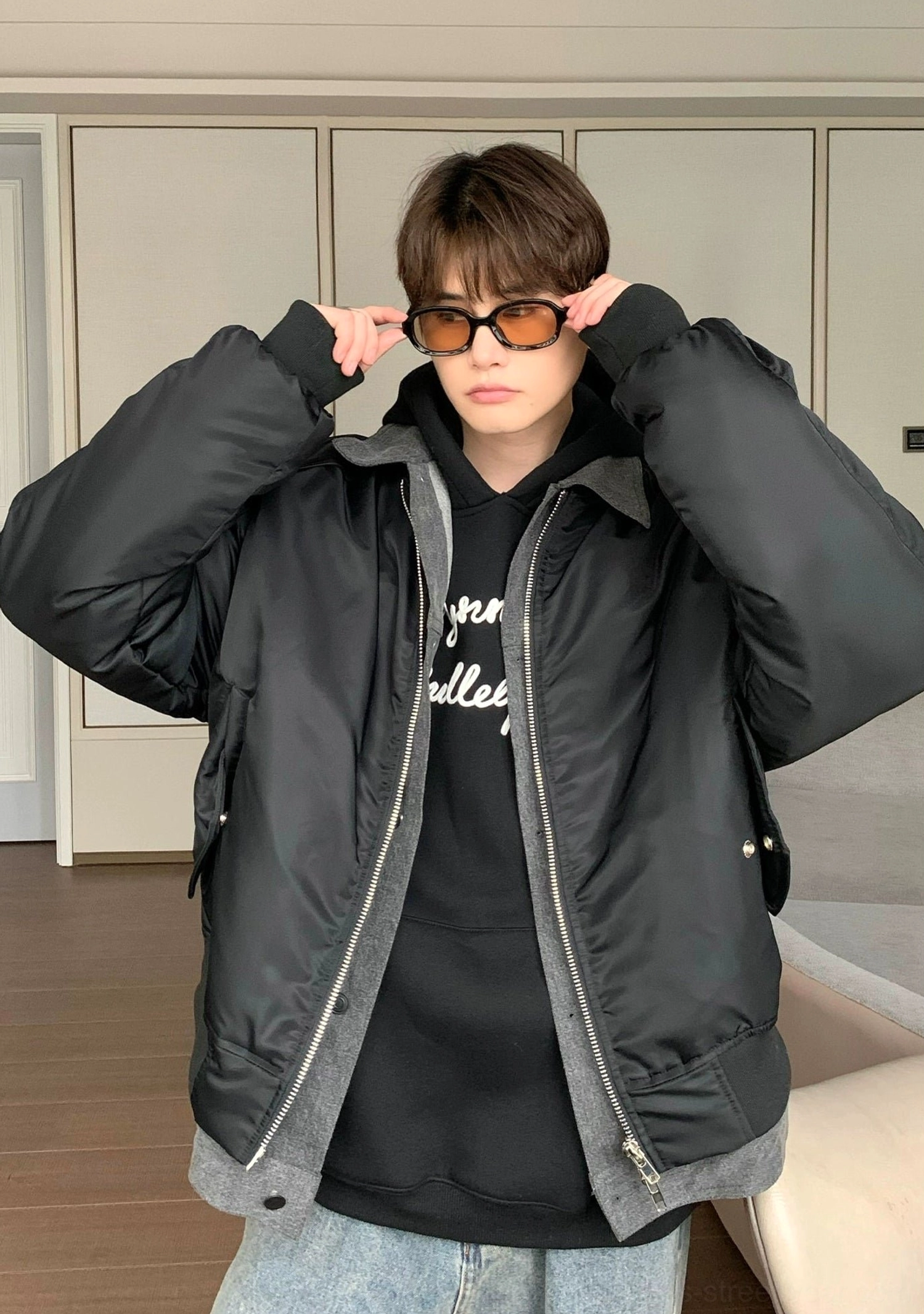 Black full zip oversized bomber jacket featuring ribbed cuffs contrast layered hem and utility pocket for Seoul streetwear outfits