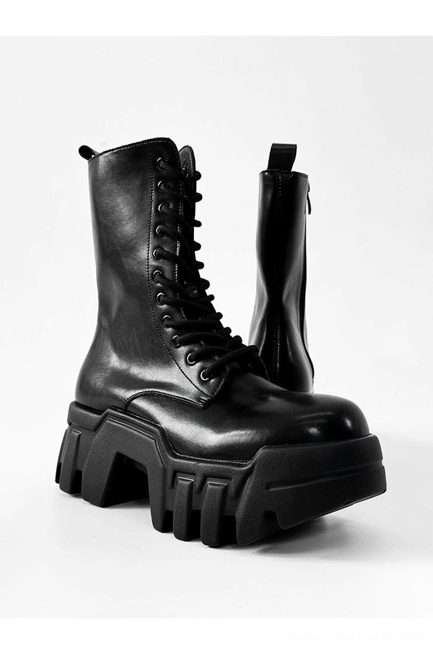 Black futuristic zip platform combat boots with lace up design and chunky rubber sole