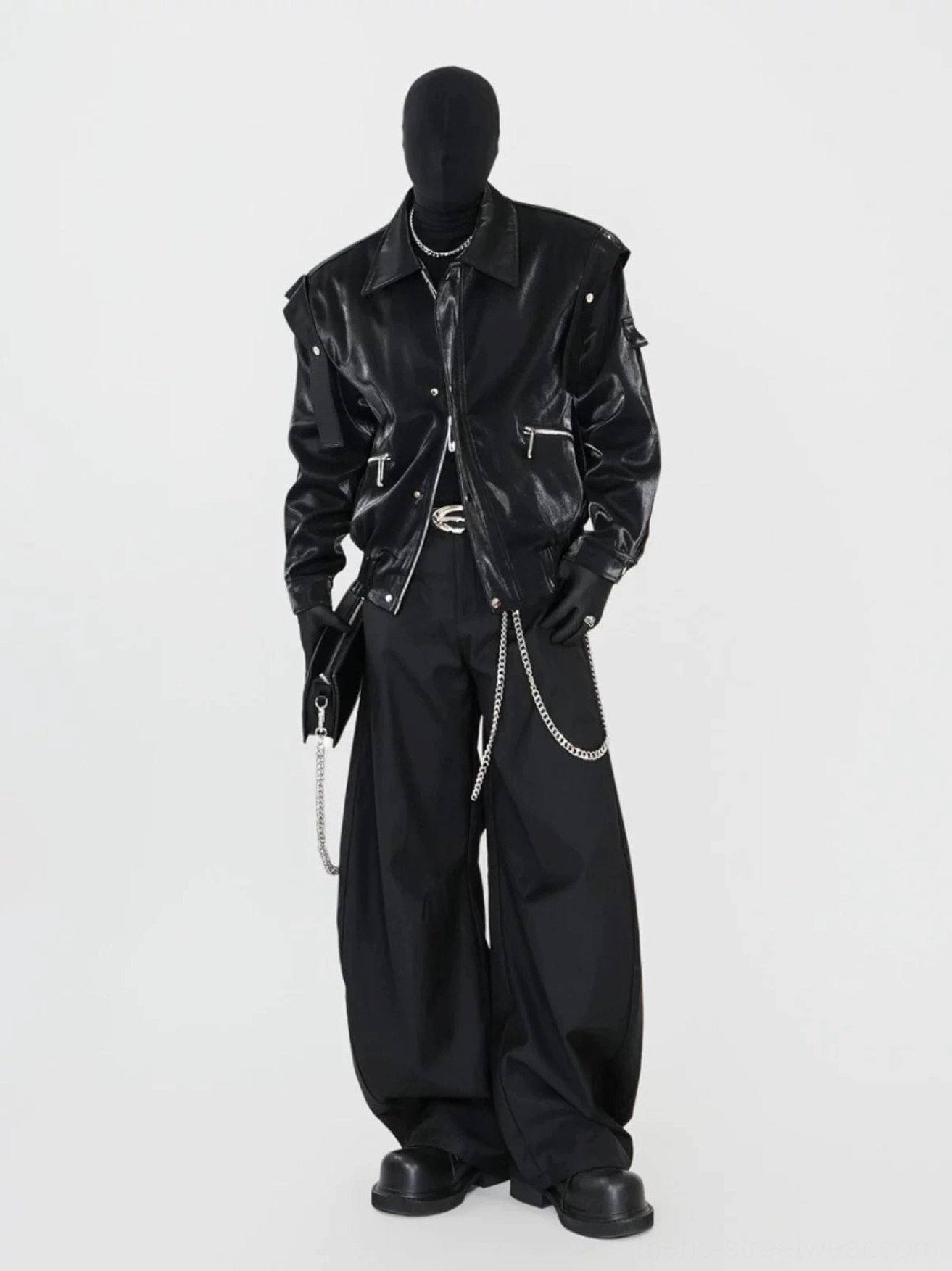 Full cyberpunk streetwear outfit featuring a black glossy biker jacket, wide-leg trousers, double chains, and leather gloves