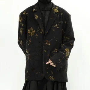 Black gold floral oversized blazer jacket angled front view with notched lapels and flap pockets