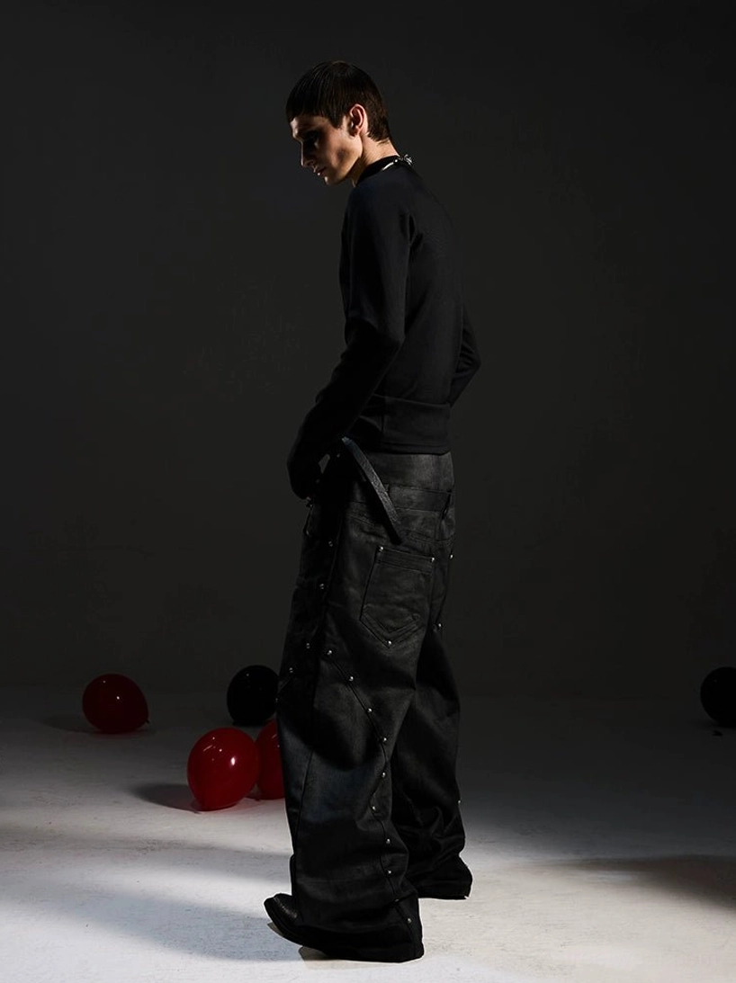 Side profile of black fitted gothic mockneck top showing high turtle neck, elongated sleeves, and clean plain back